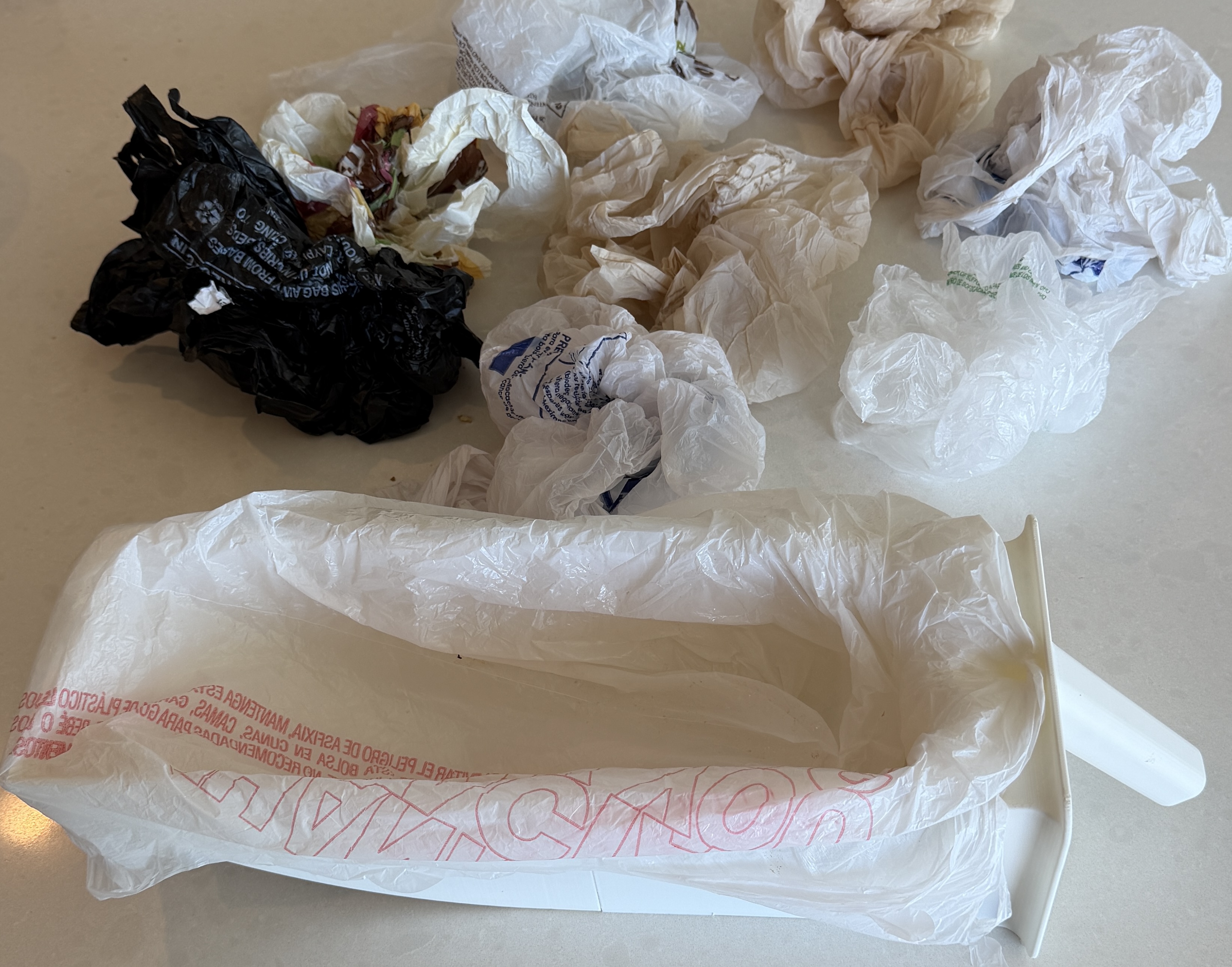 Assorted plastic grocery bags that fit the Moonbox waste drawer